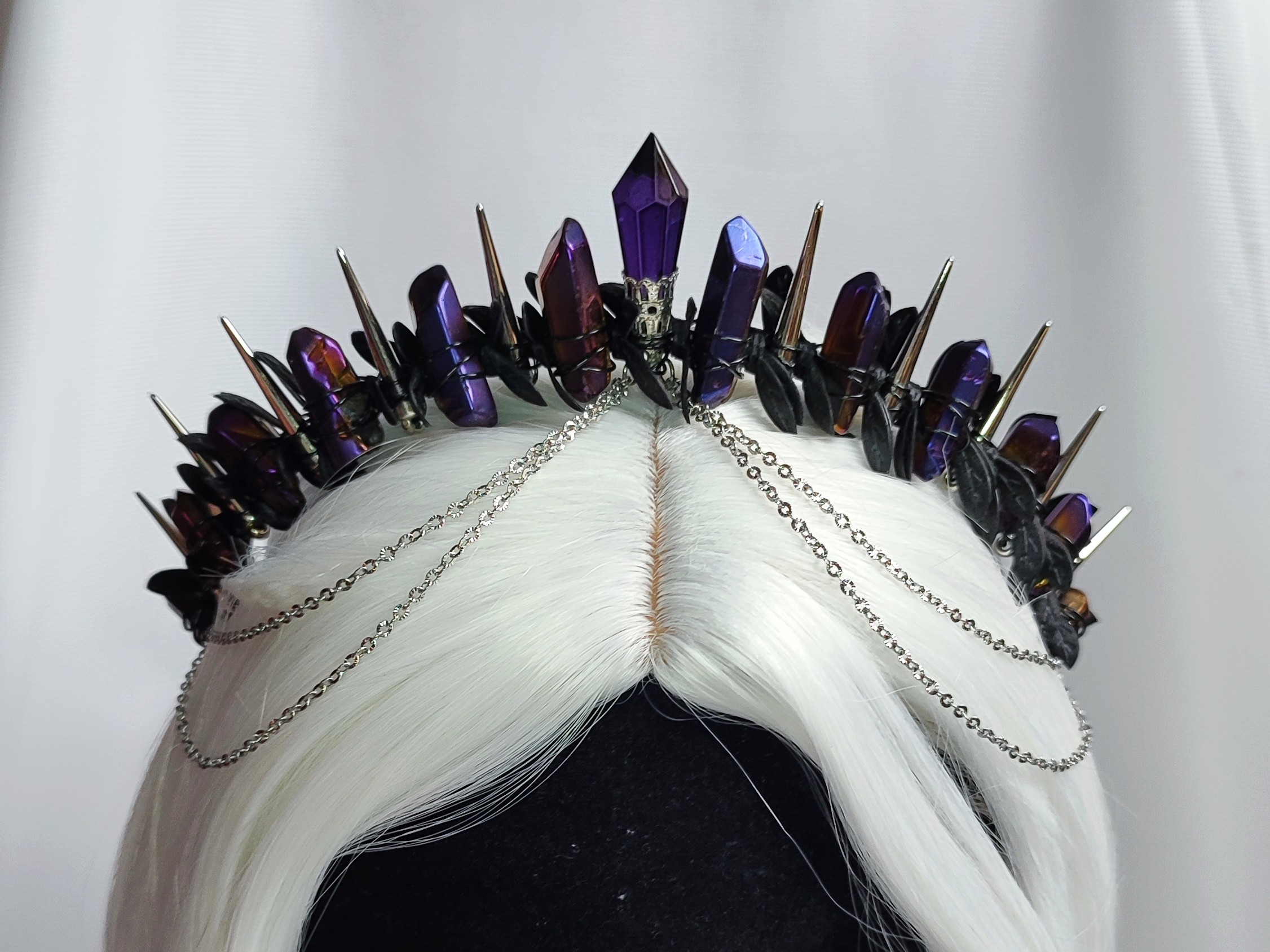 Crystal crown with purple titanium quartz, purple glass crystal, silver spikes, black leaves and chains.