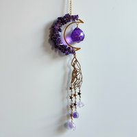 Brass suncatcher with moon, amethyst, purple crystal sphere, mystic hand and amethyst clusters.