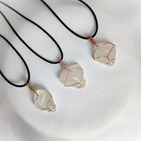 Quartz tumblestone wrapped in gold, rose gold or copper wire.