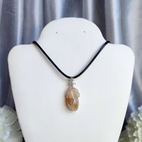 Citrine wire wrapped pendant with chain or cord.