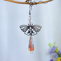 Butterfly earrings with glass crystal drops.