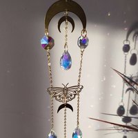 Crystal suncatcher with brass moons, butterflies and AB glass crystals.