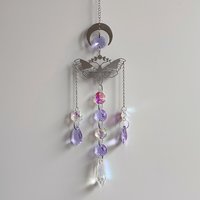 Suncatcher with silver moon, moth and purple and AB glass crystals.