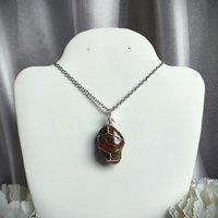 Unakite wire wrapped pendant in silver with chain or cord.