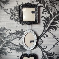 Gothic hanging photo frames in black and silver with square, oval and heart shaped frames.