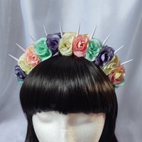 Bella unicorn headband with white spikes and pastel flowers in pink, green, purple and white.