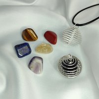 Spiral cage pendant with cord and mystery gemstones.