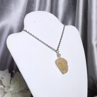 Moonstone wire wrapped pendant with chain or cord.