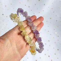 Raw amethyst and citrine headbands wire wrapped onto a silver headband.