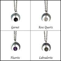 Silver moon pendant with gemstone beads.