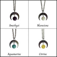 Silver moon pendant with gemstone beads.