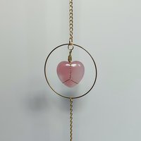 Rose quartz heart suncatcher with pink glass crystals. 