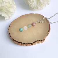Gemstone beaded pendant with rhodochrosite, green aventurine, rose quartz and amazonite.