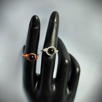 Black obsidian wire wrapped ring with silver plated or copper band.