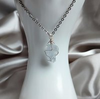 Raw celestite wrapped in silver plated wire