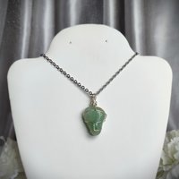 Green aventurine wire wrapped pendant in silver.