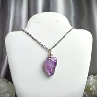 Amethyst wire wrapped pendant in silver