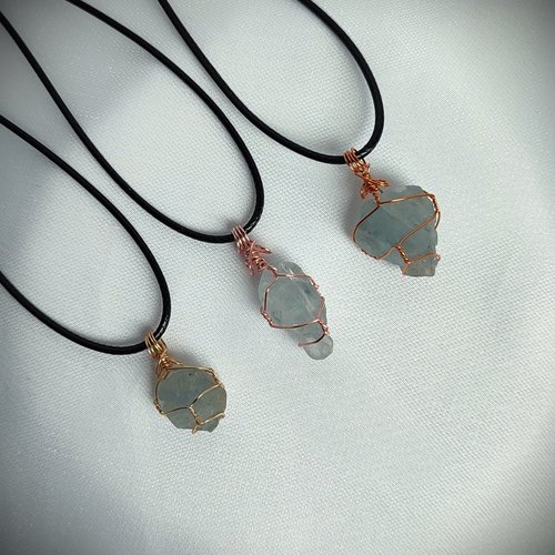 Raw celestite wrapped in gold, rose gold or copper wire with cord.
