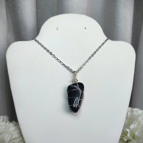 Obsidian wire wrapped pendant in silver with chain or cord.