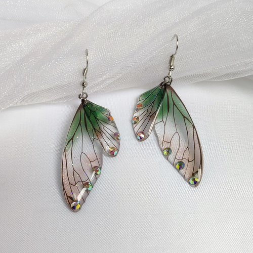 Fairy dangle earrings with clear and green resin fairy wings, glitter and diamantes. 