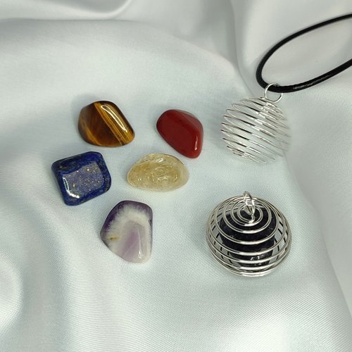 Spiral cage pendant with cord and mystery gemstones.
