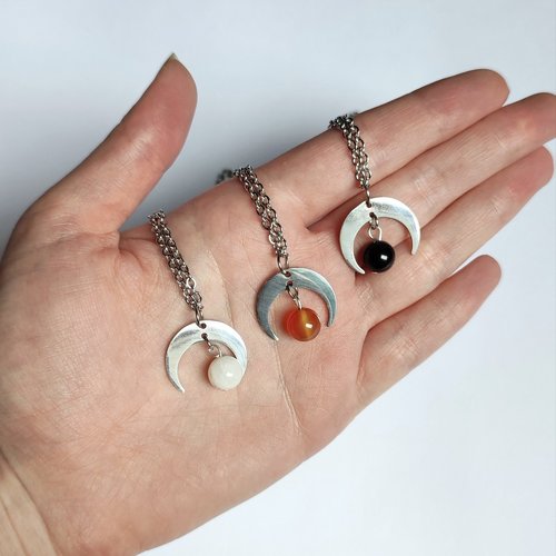 Silver moon pendant with gemstone beads.