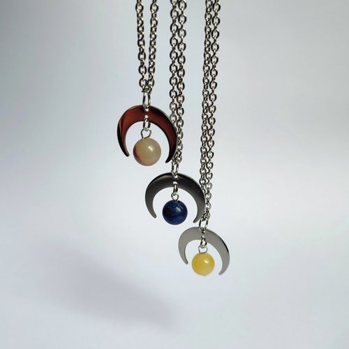 Silver moon pendant with gemstone beads.