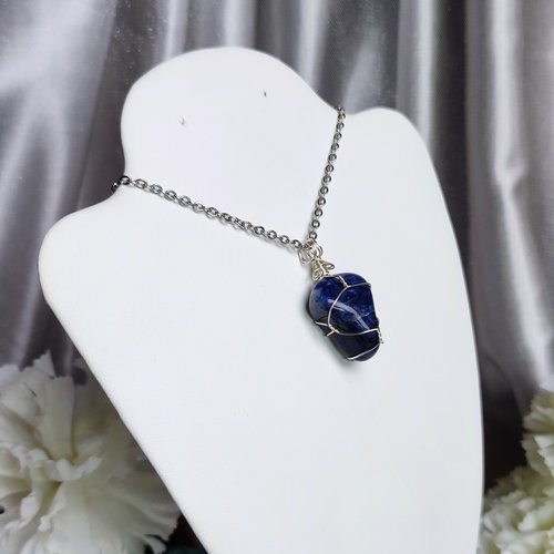 Sodalite wire wrapped pendant in silver.