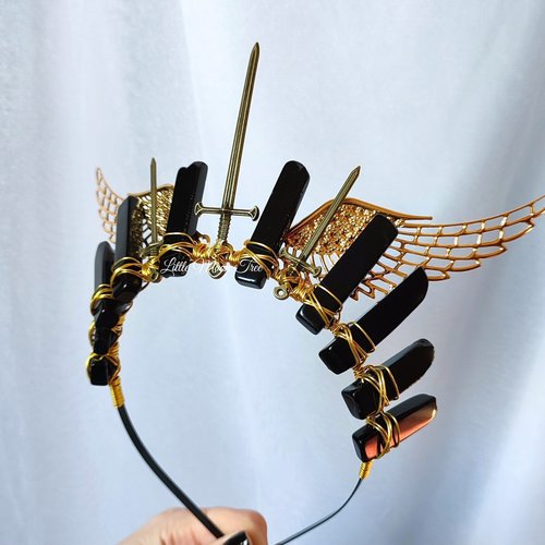 Valkyrie crown with black agate, bronze swords and gold filigree wings wire wrapped onto a headband.