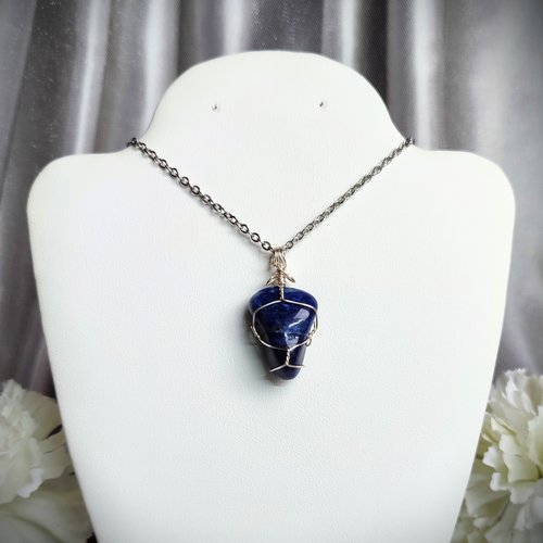 Sodalite wire wrapped pendant in silver.