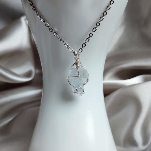 Raw celestite wrapped in silver plated wire