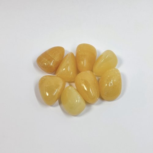 Orange calcite polished tumblestone measuring 20mm-30mm.