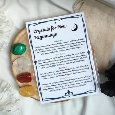 Crystal set for new beginnings with malachite, quartz, red jasper, orange calcite and information card.
