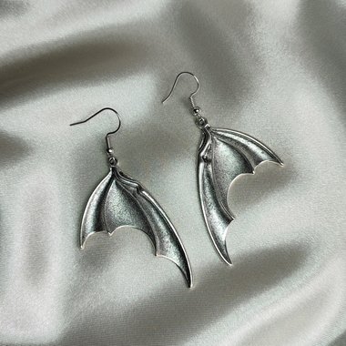 Silver bat dragon wing earrings with fish hooks.