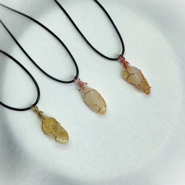 Citrine wire wrapped pendant in gold, rose gold or copper with cord.