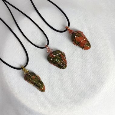 Unakite polished tumblestone wrapped in gold, rose gold or copper wire.