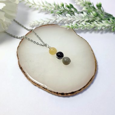 Evil entity protection pendant with citrine, onyx and labradorite.