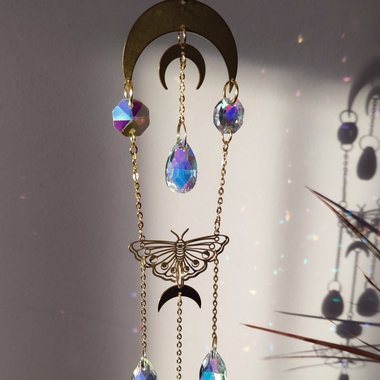 Crystal suncatcher with brass moons, butterflies and AB glass crystals.