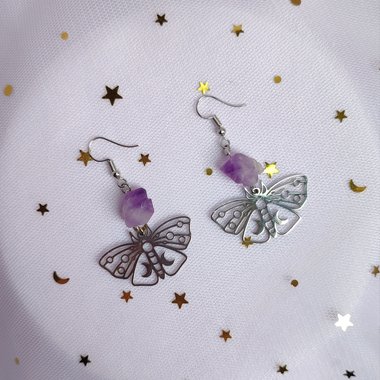 Silver butterfly drop earrings with raw amethyst clusters.