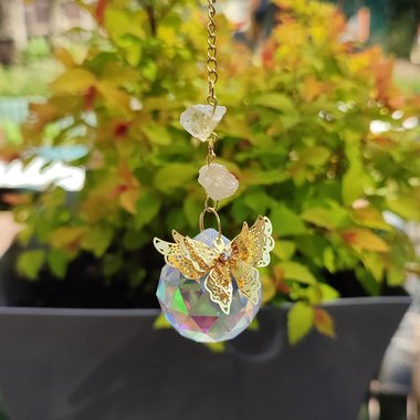 Suncatcher with crystal sphere, gold butterfly and citrine clusters.