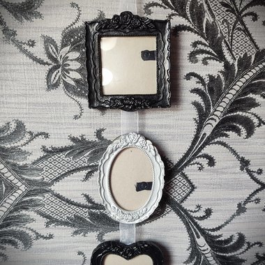 Gothic hanging photo frames in black and silver with square, oval and heart shaped frames.