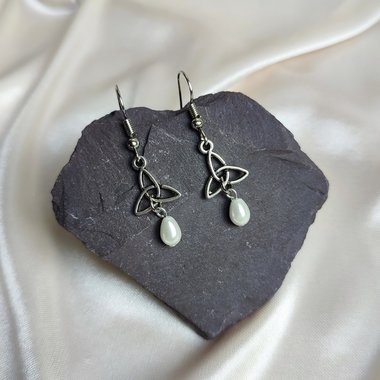 Celtic trinity knot dangle earrings with faux pearl beads.