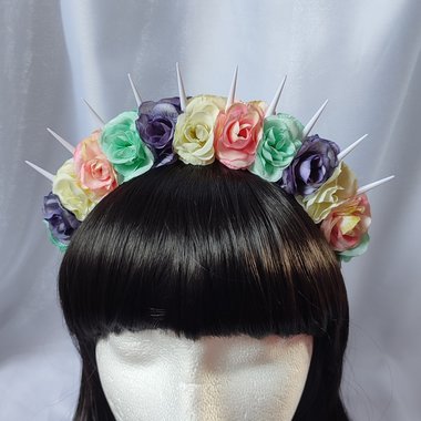 Bella unicorn headband with white spikes and pastel flowers in pink, green, purple and white.