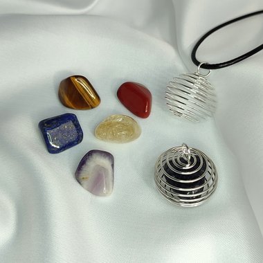 Spiral cage pendant with cord and mystery gemstones.