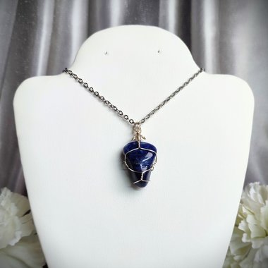 Sodalite wire wrapped pendant in silver.
