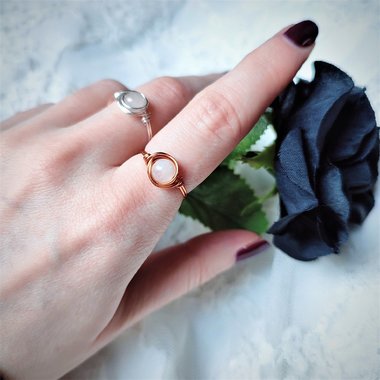 Rose quartz wire wrapped ring with silver or copper band.
