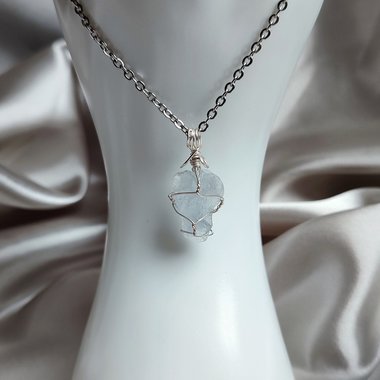 Raw celestite wrapped in silver plated wire