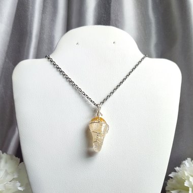 Citrine polished tumblestone wrapped in silver plated wire.