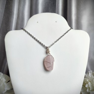 Rose quartz wire wrapped pendant in silver.