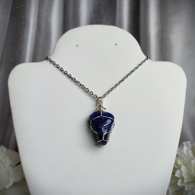 Sodalite wire wrapped pendant in silver.